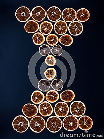 Hourglass made from dried orange slices Stock Photo