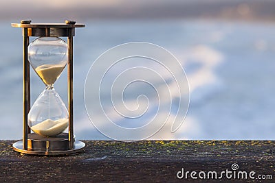 Hourglass Outdoors with Ocean Background Stock Photo