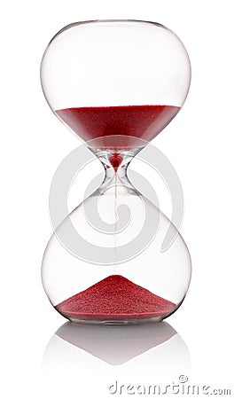 Hourglass with red sand running through Stock Photo