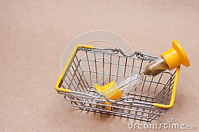 An hourglass in the shopping basket. concept of time Stock Photo