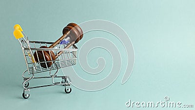 Hourglass in shopping cart. Buying time concept, time is money Stock Photo
