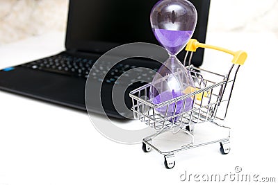 Hourglass in a shopping trolley Stock Photo