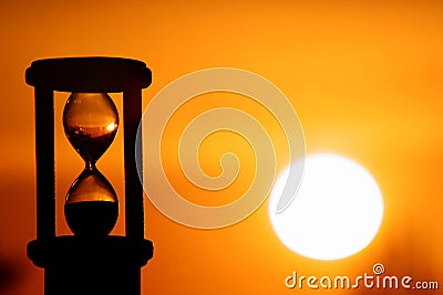 Hourglass in sunset Stock Photo