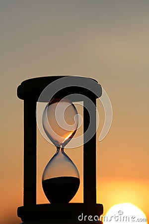 Hourglass in sunset Stock Photo