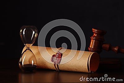 Hourglass, wooden gavel and testament and last will on wooden table in notary office Stock Photo