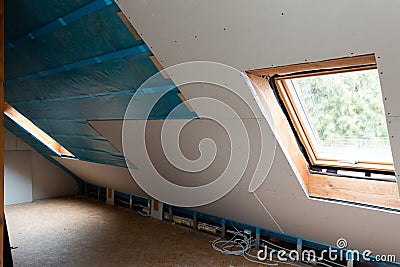 House attic insulation and renovation. Drywall construction Stock Photo