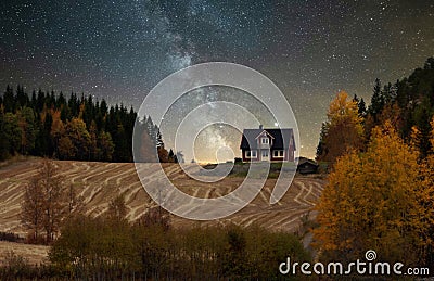 A house in autumn landscape in the evening Stock Photo