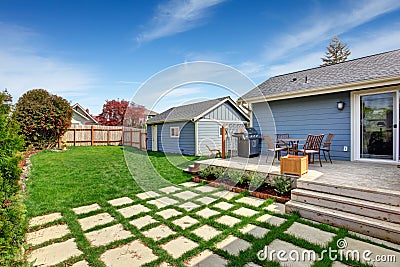House backyard with patio area on walkout deck Stock Photo