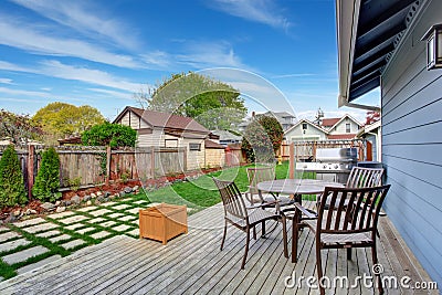 House backyard with patio area on walkout deck Stock Photo