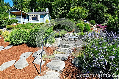 House with beautiful curb appeal and outdoor rest area. Port Orc Stock Photo