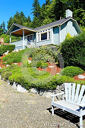 House with beautiful curb appeal and outdoor rest area. Port Orc Stock Photo