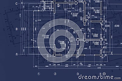 house blueprint on architects desk, engineering drawings and plans on blue background Stock Photo