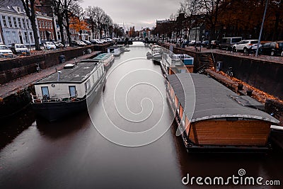 House boats on a canal in the Netherlands Editorial Stock Photo