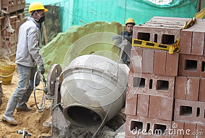 House builder (bricklayer) at work. Stock Photo