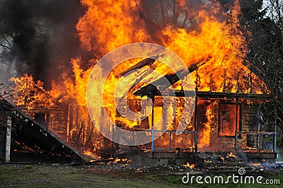 Side view Burning house flames front view Stock Photo