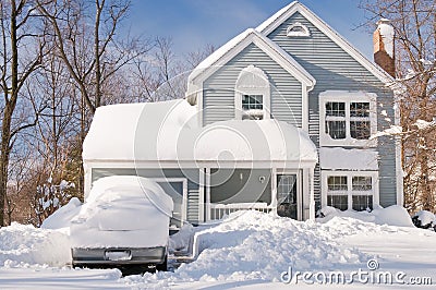 House and cars after snowstorm Stock Photo