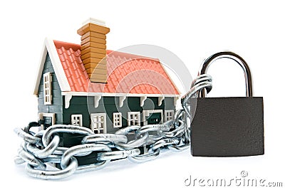 House in chains locked with padlock Stock Photo