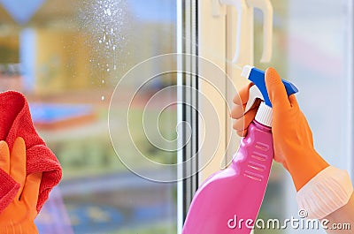 Window cleaning. Spray for cleaning in hands Stock Photo