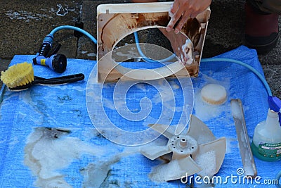 Cleaning of the kitchen exhaust fan Stock Photo
