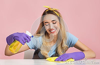 House cleaning with smile. Housewife wipes dust Stock Photo