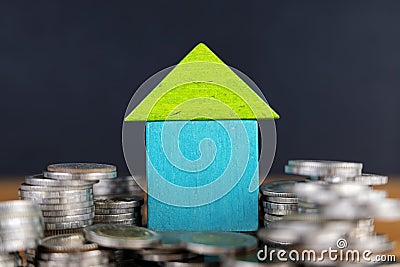 House on a coin pile, real estate investment, save money with a coin pile Stock Photo