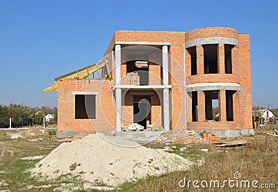 Brick House construction site. Building construction brick house. Unfinished Home Construction. Stock Photo