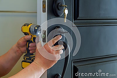 house exterior door with the inside internal parts of the lock visible of a professional locksmith installing or repairing a new d Stock Photo