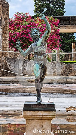 POMPEII, ITALY, JULY 19, 2021: Bronze statue of the dancing Faun at the House of the Faun in Pompeii Editorial Stock Photo