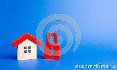 House figurine and a red padlock. Security and safety. Confiscation for debts. alarm system. seizure of property. Protection Stock Photo