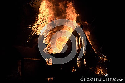 House fire with intense flame, fully engulfed house fire Stock Photo