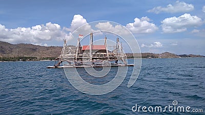 The house that floats on the water is where the fishermen stay to catch fish Stock Photo