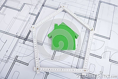 House in folding ruler on blueprint Stock Photo