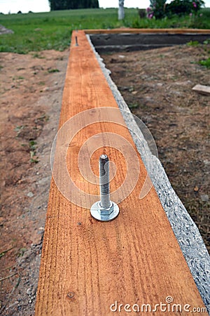 House foundation construction with wood plank and anchor Stock Photo