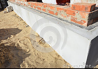 House foundation wall insulation, plastering, damp proofing, waterproofing Stock Photo