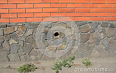 House foundation wall ventilation hole Stock Photo