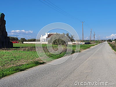 House in front of a country road in Athienou Cyprus Stock Photo