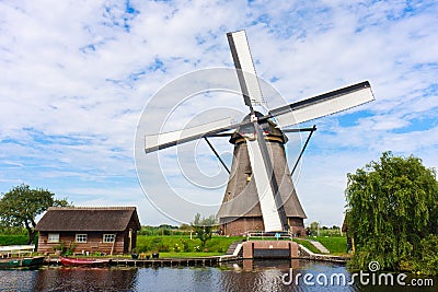 Traditional Dutch windmill with its house Stock Photo