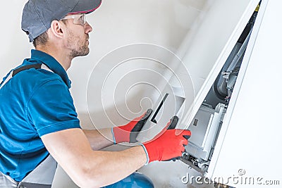 House Heating Unit Repair Stock Photo