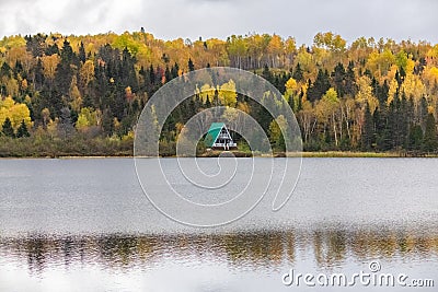 House hidden in the forest on the lake in Canada Stock Photo