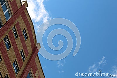 Upper floors of a high-rise building against the sky Stock Photo