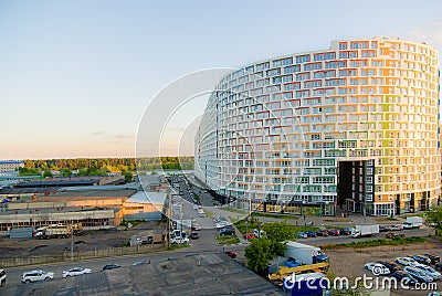 The house is a horseshoe, the production facilities of the city are nearby. A lake, then a forest. Editorial Stock Photo