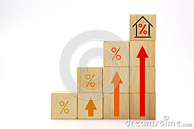 House interest rate with rising percentage and high up arrow icon on wooden blocks cube. Stock Photo