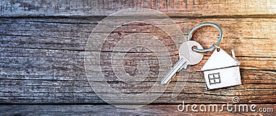 House Key And Keychain On Wood Stock Photo