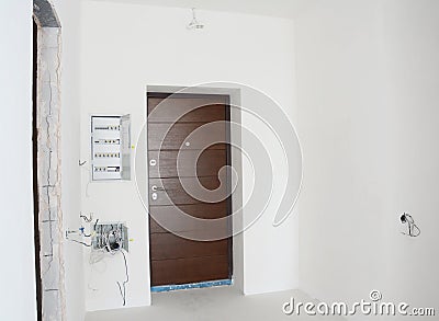 House metal entrance door with mounted open electric meter box with residual current device or RCD Stock Photo