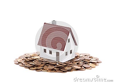 House miniature with pile of coins Stock Photo