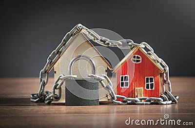 House model with a chains and padlock Stock Photo