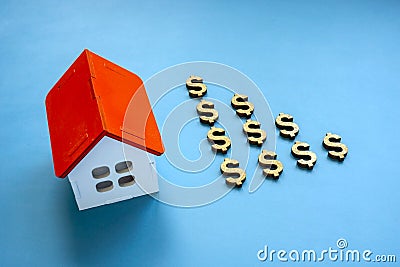 House model and dollar signs. Reverse mortgage concept. Stock Photo