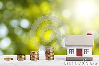 House model and golden coins stacks Stock Photo