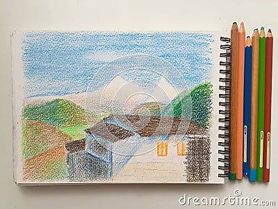 House and mountains on a white background with pencils, Himalaya sketchbook Stock Photo