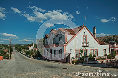 House next to a road passing through countryside Stock Photo